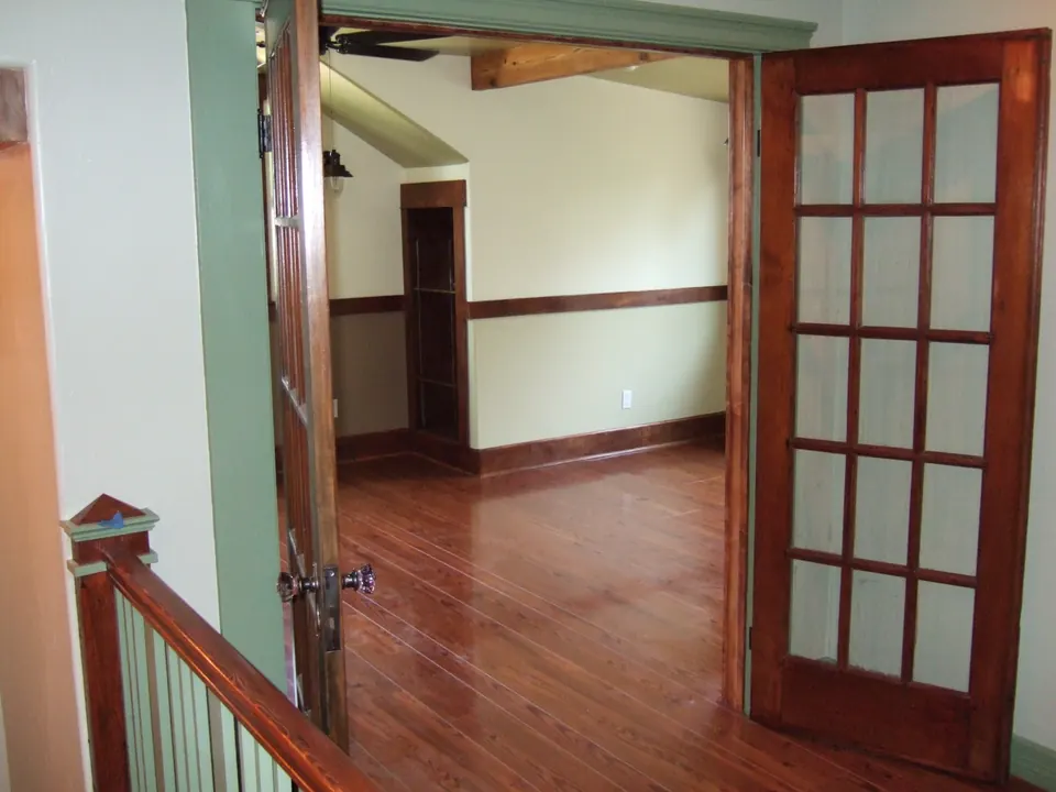 French doors and longleaf pine newel post in the upstairs addition