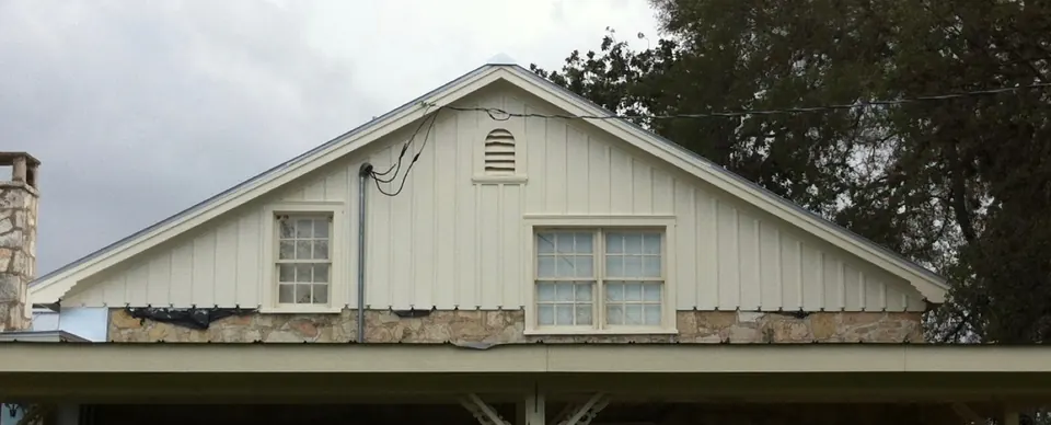 Ranch house gable after new walls, restored siding and fresh paint